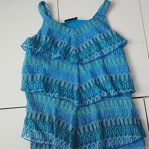 A kids teal and green blouse